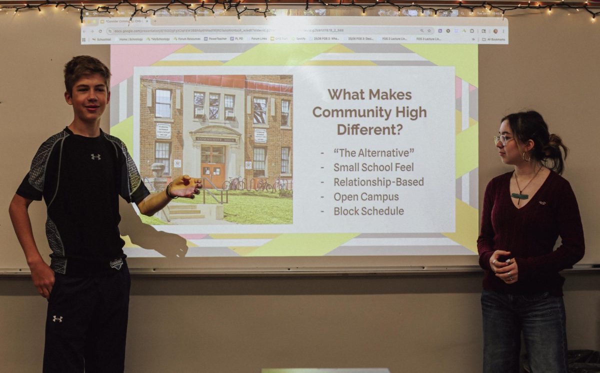 Eli Griffith (left) and Mira Authier (right)
present about CHS to middle
schoolers. "I think that it's important
for middle schoolers to learn about the
opportunities we have at Community,"
Authier said. "I hope they realize that it's not scary to apply."
