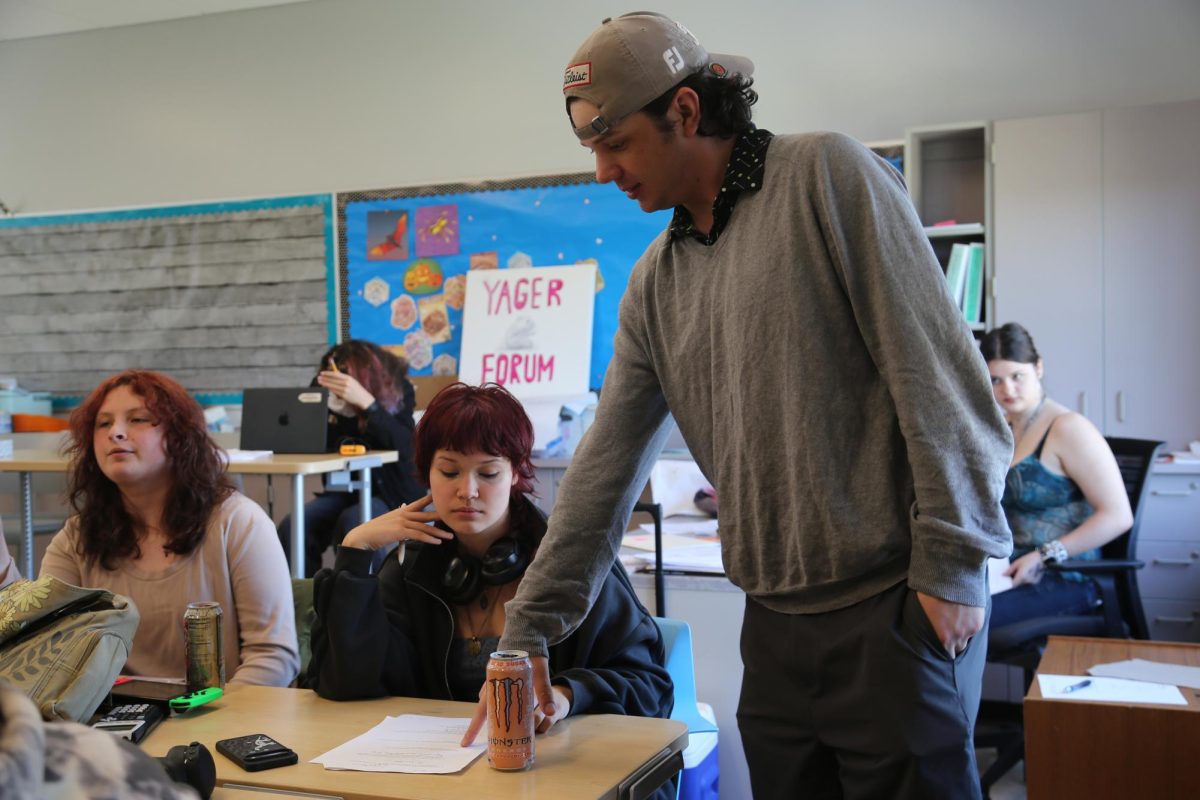 Ryan Farr helps his student during his block four class.