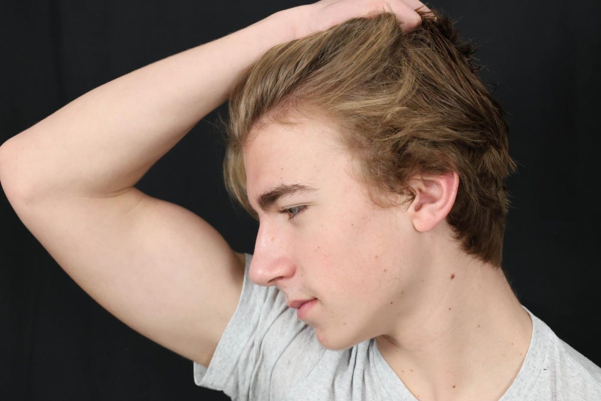 James Dickson runs his hand through his hair.