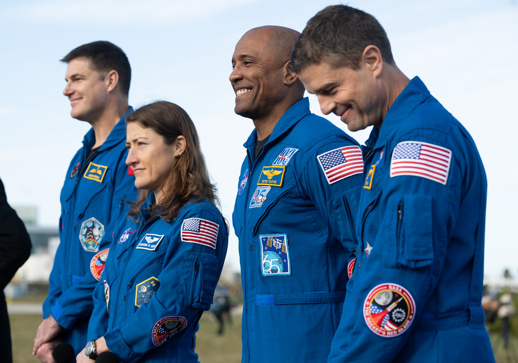 CSA (Canadian Space Agency) astronaut Jeremy Hansen, Artemis II mission specialist, left, NASA astronauts Christina Koch, Artemis II mission specialist, Victor Glover, Artemis II pilot, and Reid Wiseman, Artemis II commander are seen as members of the media ask questions as NASA’s Artemis II SLS (Space Launch System) rocket and Orion spacecraft rolls out to Launch Complex 39B at NASA’s Kennedy Space Center in Florida on Saturday, Jan. 17, 2026. In the coming weeks, engineers will prepare for the wet dress rehearsal, a two-day test that simulates launch day. The Artemis II test flight will take Wiseman, Glover, Koch, and Hansen around the Moon and back to Earth no later than April 2026. Photo Credit: (NASA/Joel Kowsky)