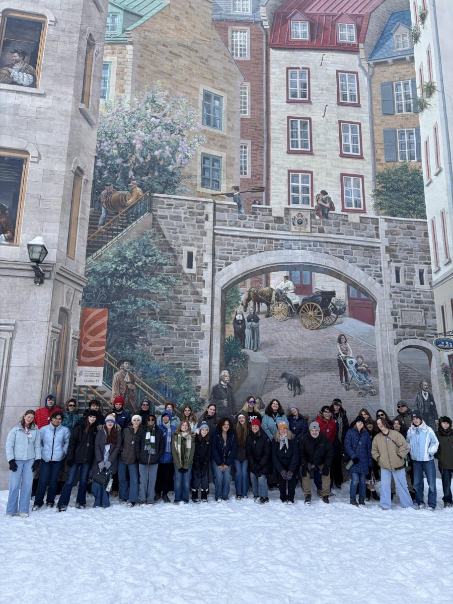 CHS students stand outside in Quebec and pose for a group photo.