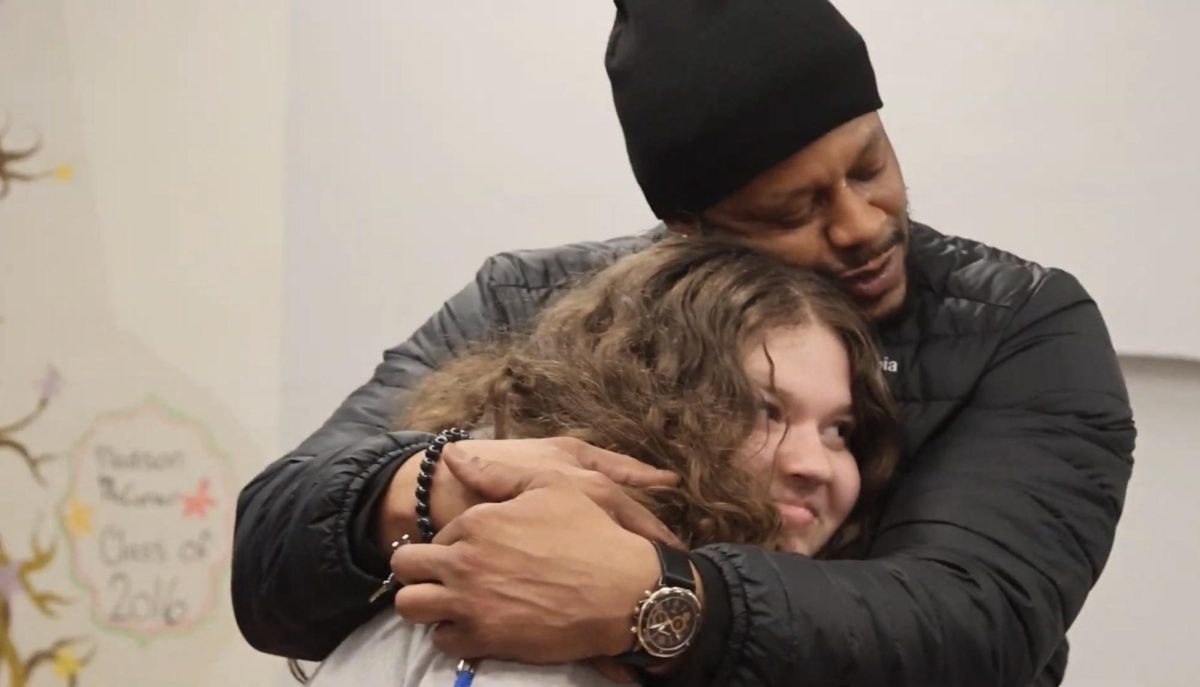 Carl Taylor seen hugging student Zola Saigal in the CHS hallways.
