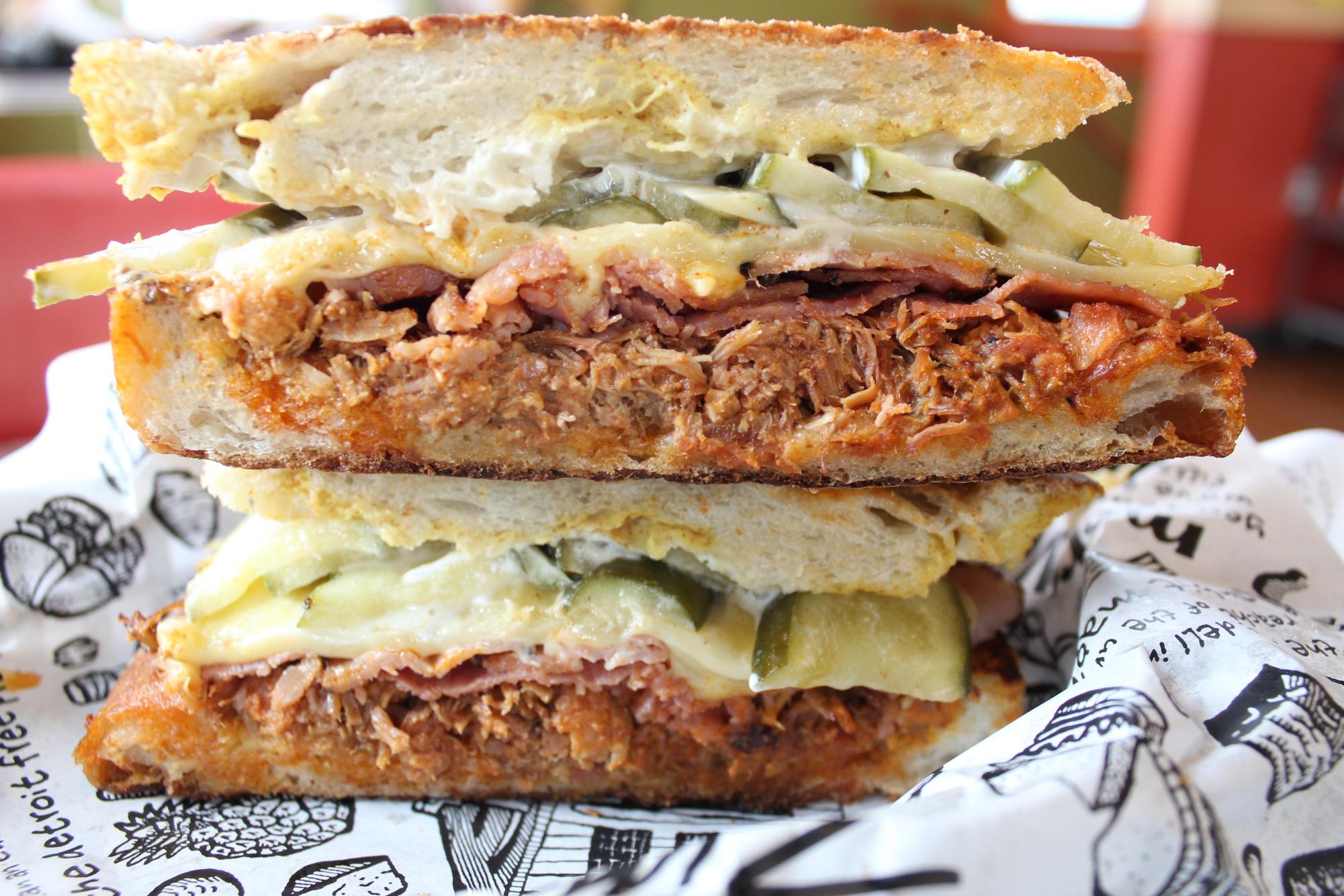 The classic Zingerman's "Cuban Conundrum" pulled pork sandwhich. 

Photo Courtesty of Zingerman's Delicatessen 