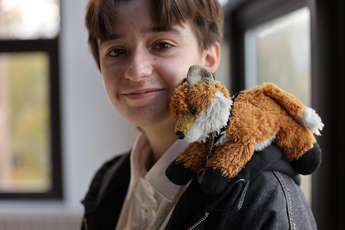 Freshman Ollie Levitsky poses with a stuffed fox. He had gotten the fox, named Cheeto, years ago on a trip. "He helps me manage my anxiety," Levitsky said. "Just by existing and being soft."