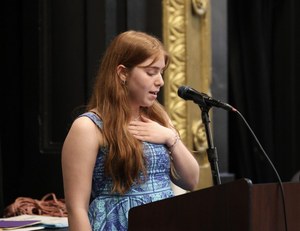 Liliana Amjadi Klass gives her introduction speech for Ellie Fox at the journalism banquet. She had been looking forward to introducing Fox, who played a big role in her growth throughout high school. “Ellie has been a very important part of my high school experience, especially in journalism,” Amjadi Klass said. “It’s sad to see her leave, but I’m excited to see where life takes her.”