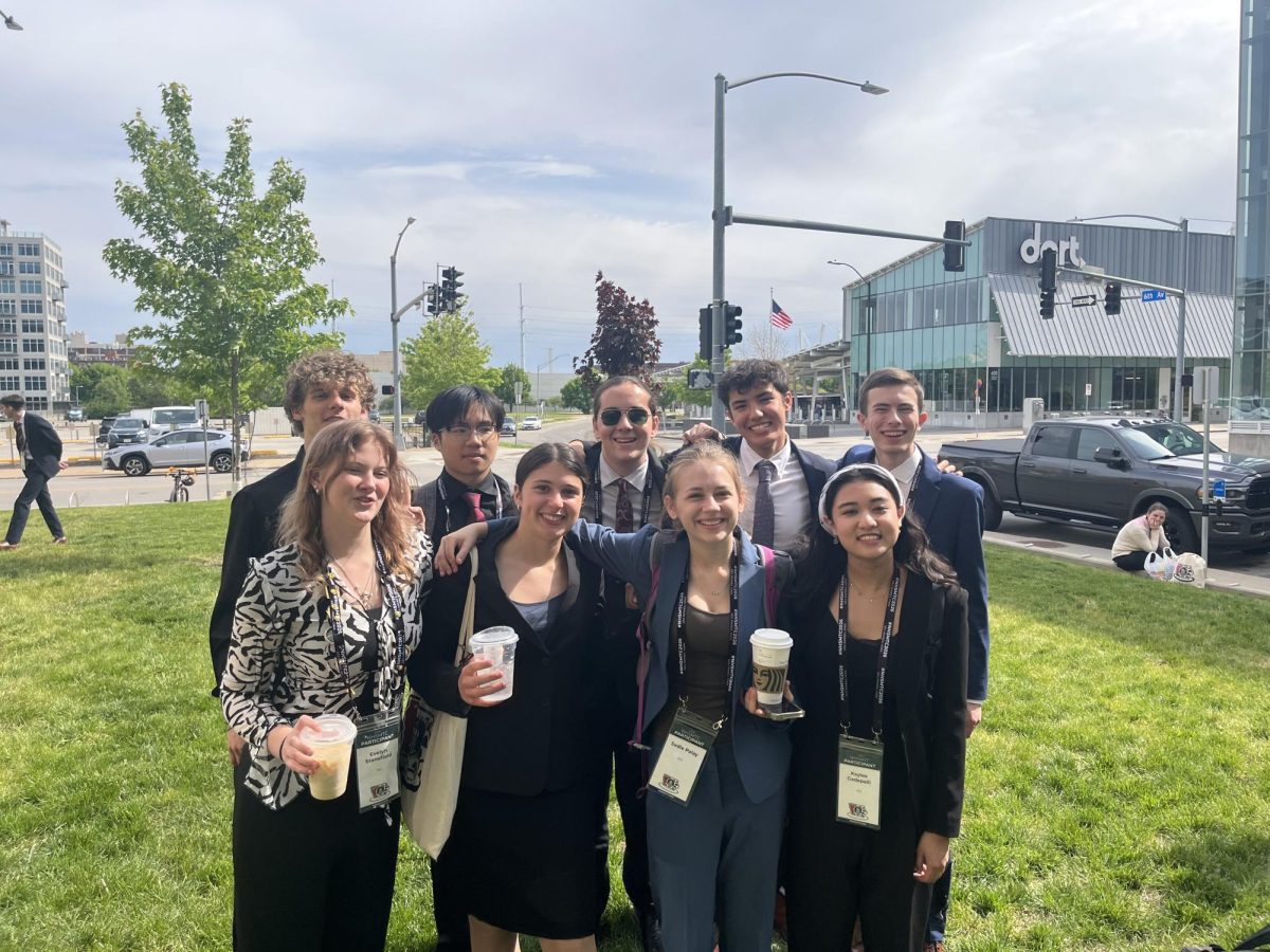 Mock Trial's A Team poses outside of a courthouse. (Back row, left to right: Walker Ledbetter, Wilson Zheng, Dylan Goldman, Eli Feng and Noah Lauring. Front row, left to right: Evelyn Stansfield, Willow Rosenfeld, Sadie Pallay and Kaylee Gadepalli.)