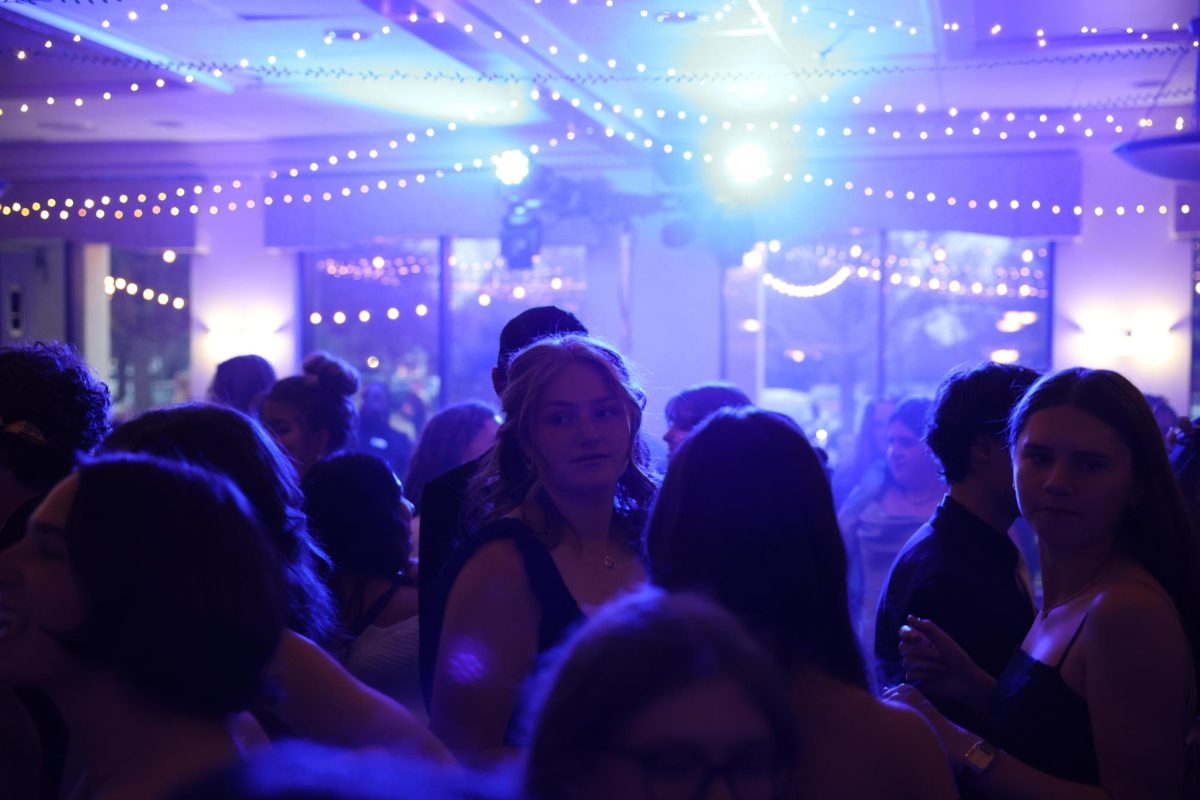 Lucy Lowenchuss takes in the scenery and energy of the busy prom atmosphere.