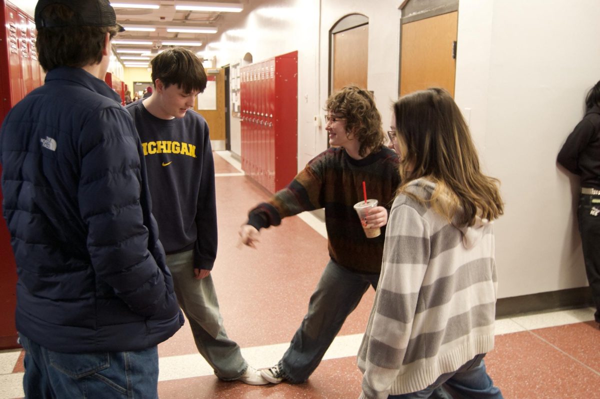 Mira Authier, Finn Carpenter, Jameson Grice and Thomas Radesky stretch during break. Currently they're doing a difficult unit in Con Parker's Algebra 2 class, and after walking around, Grice thought it would be good idea to stretch. "During our breaks in math it's always so fun to go out in the hallways and stretch," Grice says. "It's a refreshment after the silence of math class."