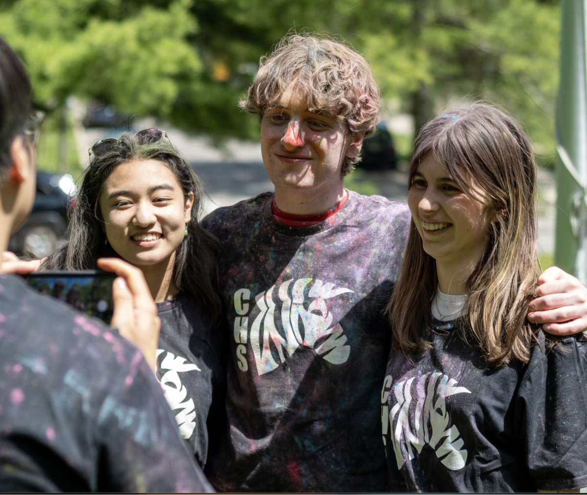 Elijah Makman-Levinson (center) poses for a photo with friends after a part of CHS's senior celebrations. 