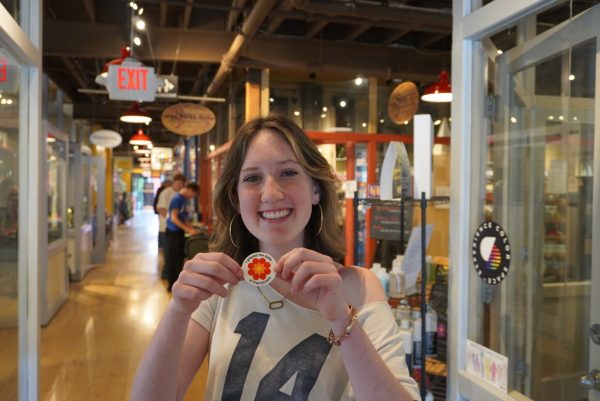 Sophmore Veronica Herrold proudly holds up a "I played the bells at Kerrytown" with a wide smile.