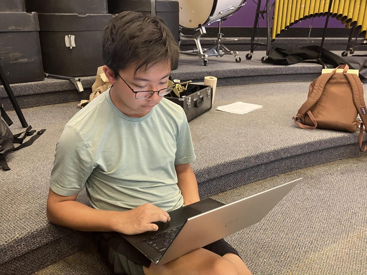 Joey Hwang works on his original composition on his computer.
